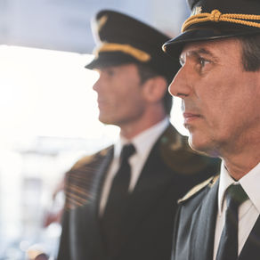Pilots in uniform standing in a line