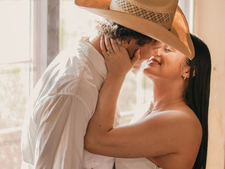 Couple sharing a romantic moment at sunset during a surprise proposal near Amarillo Texas at Cornerstone Ranch Events Center wedding venue in the Texas Panhandle
