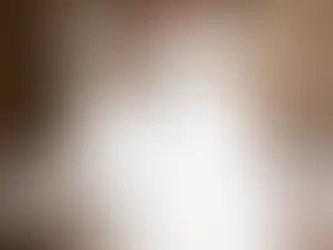 Amarillo Bride twirls in an elegant white wedding gown, set in a luxurious room with ornate paneling and a chandelier, creating a dreamy atmosphere.