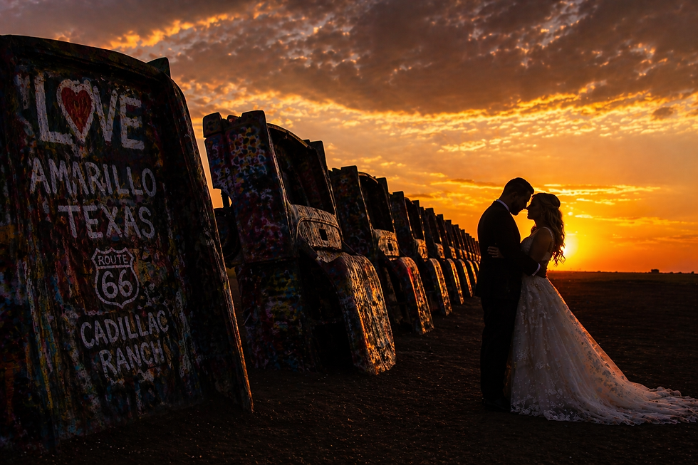 A newlywed couple embraces at sunset near painted cars at Cadillac Ranch. Text reads "Love Amarillo Texas Route 66 Cadillac Ranch." Romantic mood. Route 66 wedding venue, Unique wedding venue in Amarillo. Unique wedding venues in Texas, Texas destination wedding venue.