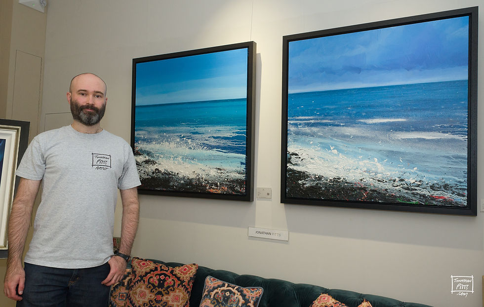 Jonathan Pitts, artist, with his ocean art at Cotswold Contemporary in Burford