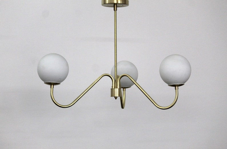 Thumbnail: Handcrafted Mid Century Elegance The Enchanting Brass Milky Ball Chandelier