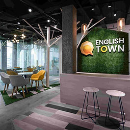 English Town is an English listening and speaking center for everyone. Communication is a need and has been formed since people were in caves and forests. We borrow this element as the main idea for English Town. The classrooms are divided into nine small classrooms of nine caves, from which one can spread the teaching in larger spaces than forests. Each cave is used a different form, shape and detail. When leaving the cave, the interactive space will be a forest with roads, canopy, grass ... all expressed in stylized language, through materials, light shapes. Focusing on communication features, so speaking more than writing, tables and chairs are flexible, compact and easy to rotate.