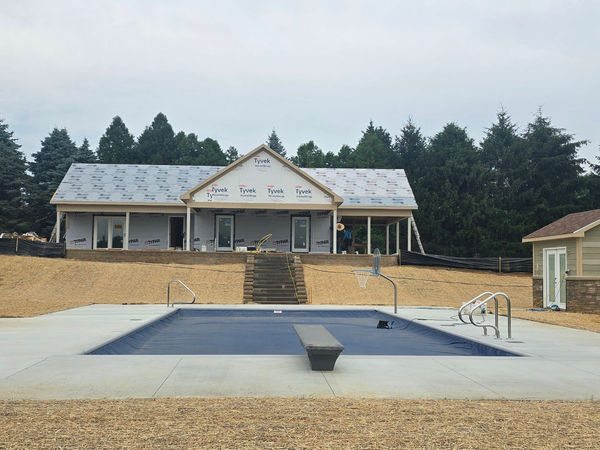 Pool house under construction by HTH Construction
