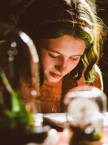 Whimsical closeup of a teenager sitting in beautiful, glowing sunlight. Creative senior portrait photography by Lexi Bird Photography, Montgomery County, PA