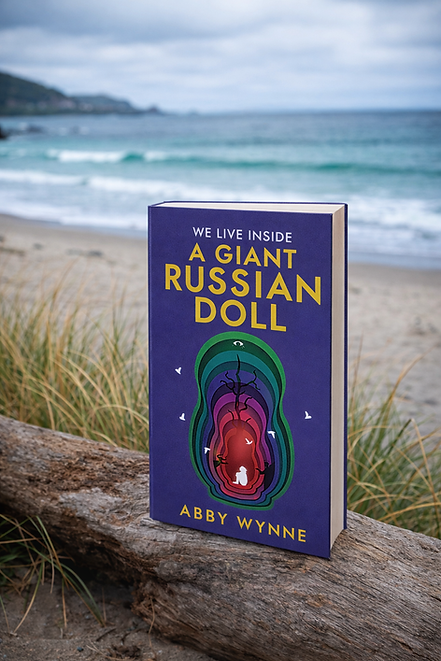 Book on log by the beach.png