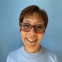 Teacher Lynda at the play pen
