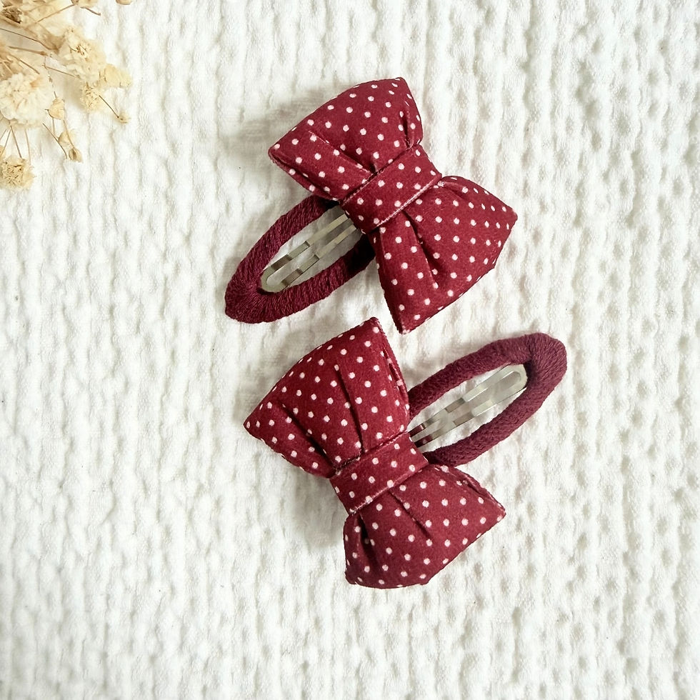 Thumbnail: Red Polka Dot Bow Clips — dot bow clips, detail view 2. Mira Accessories, handmade in South Africa