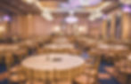 Wedding reception lighting transformation with amber and blue uplighting in Houston