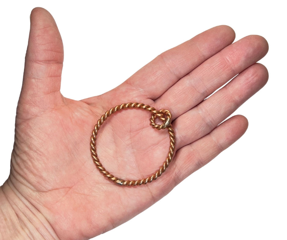 2" GFL Tensor Ring Pendant in palm of hand for size comparison