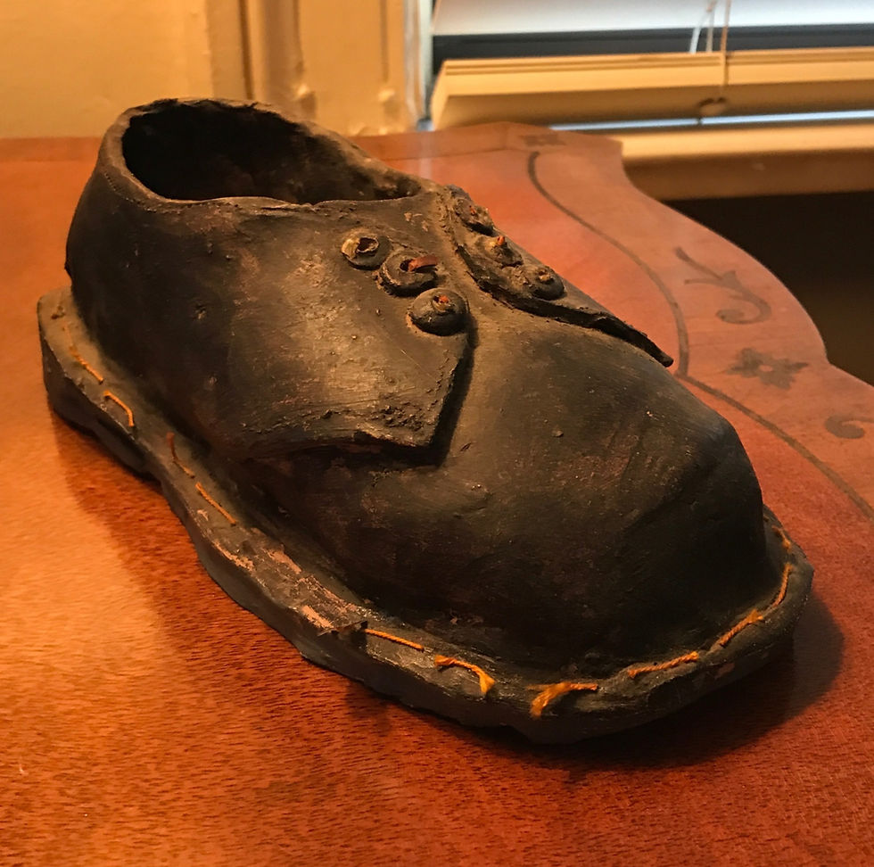 Caron's ceramic rendering of her first pair of Dr. Martens;)