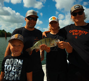 multiple clients holding a perch during a guided fishing trip in the netherlands