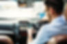 A man using a mobile phone whilst he is driving