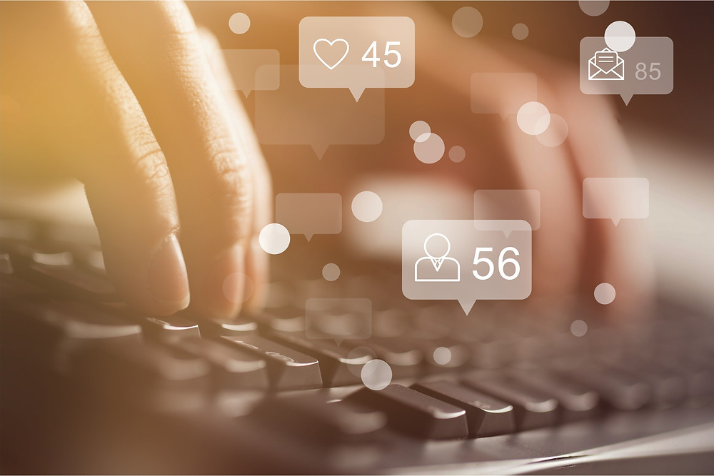 Person typing on a keyboard gaining more likes, followers and opens on an email