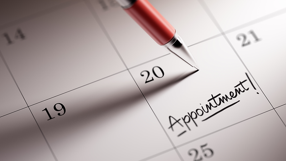 appointment being written in a calendar
