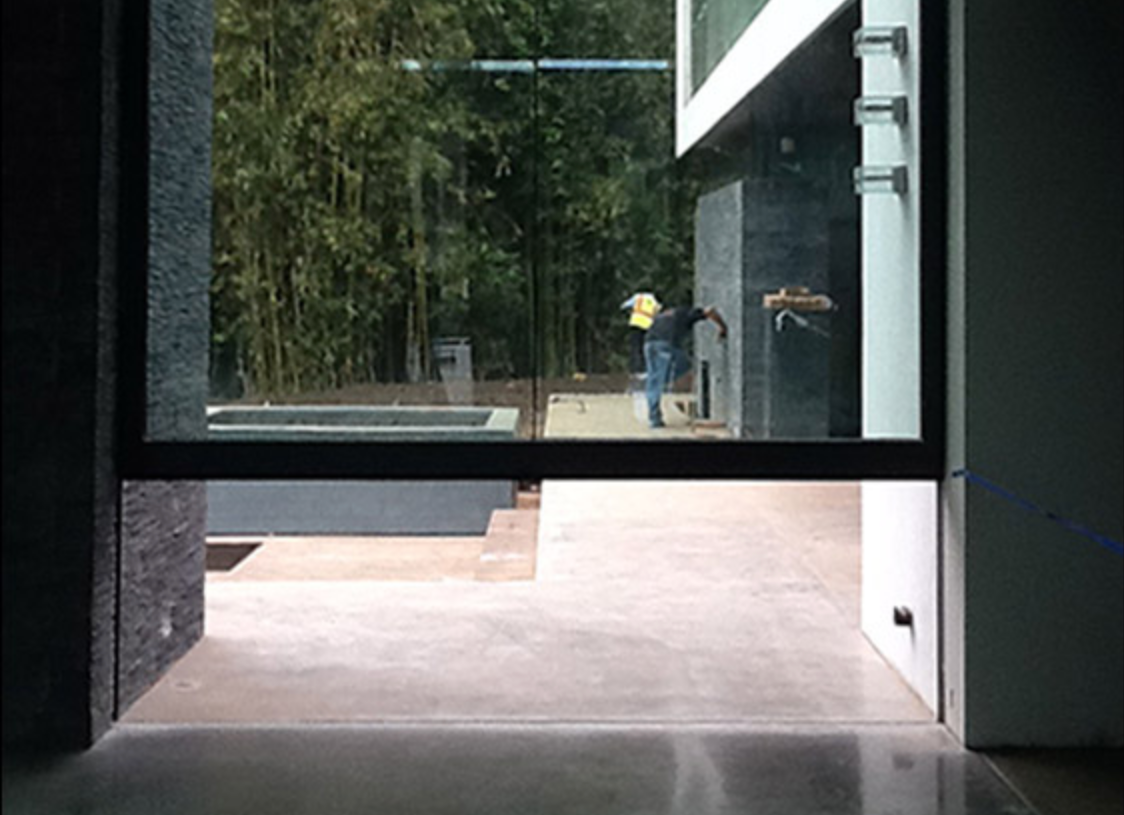 A view of this High-End residence during the day that shows the Lift partially open.