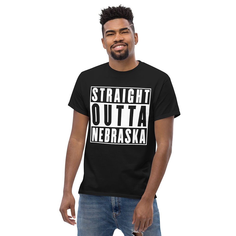 Thumbnail: Store product image showing male modeling front of black "Straight Outta Nebraska T-shirt" for sale  