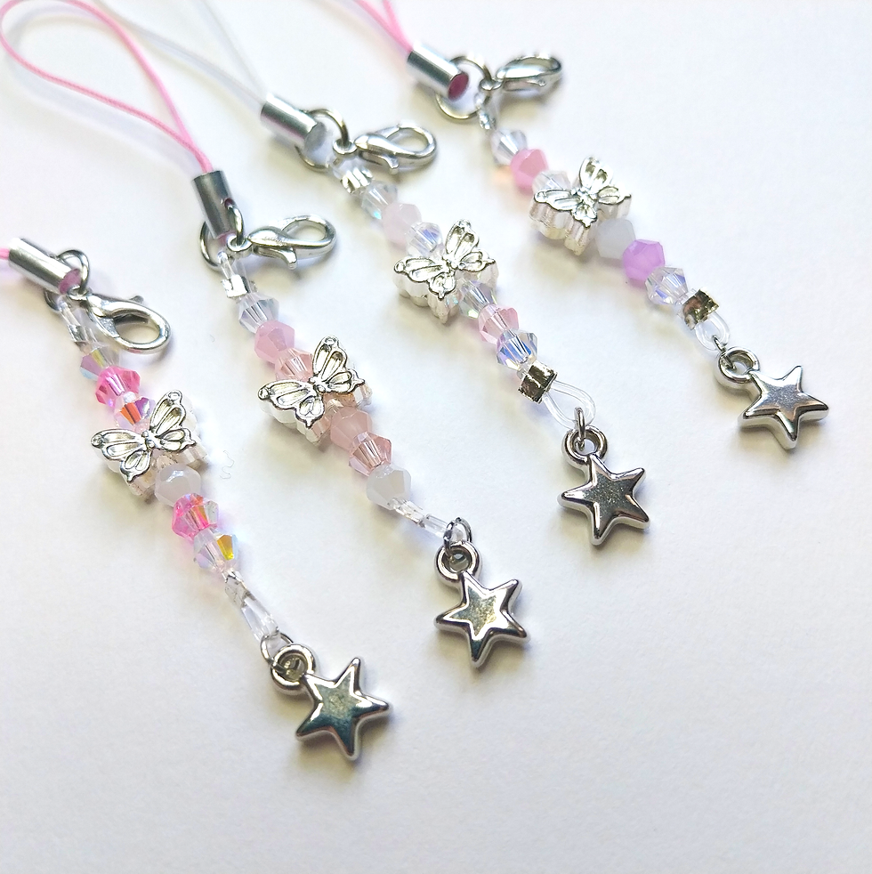 Four handmade jewellery charms with stars and bows
