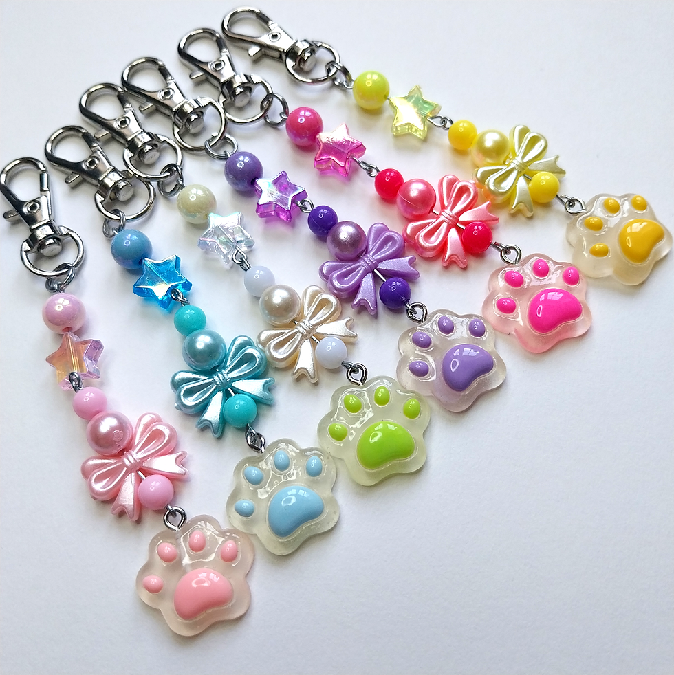 Colorful handmade keychains with beads and paw print charms
