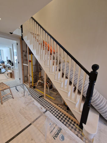 Custom wardrobes, shelving, and fitted under-stair storage for homes