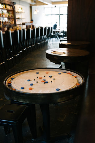 crokinole game inside the doppelganger bar