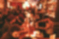 interior of the doppelganger bar showing bartenders makign drinks and people at the bar drinking and talking