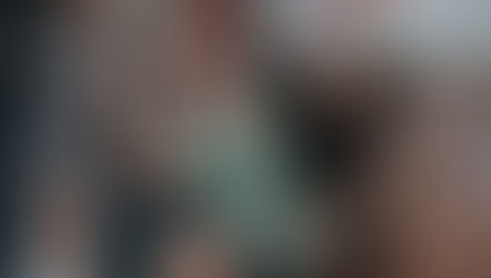 Coaches assist a member doing squats in the Rx Performance gym in Singapore