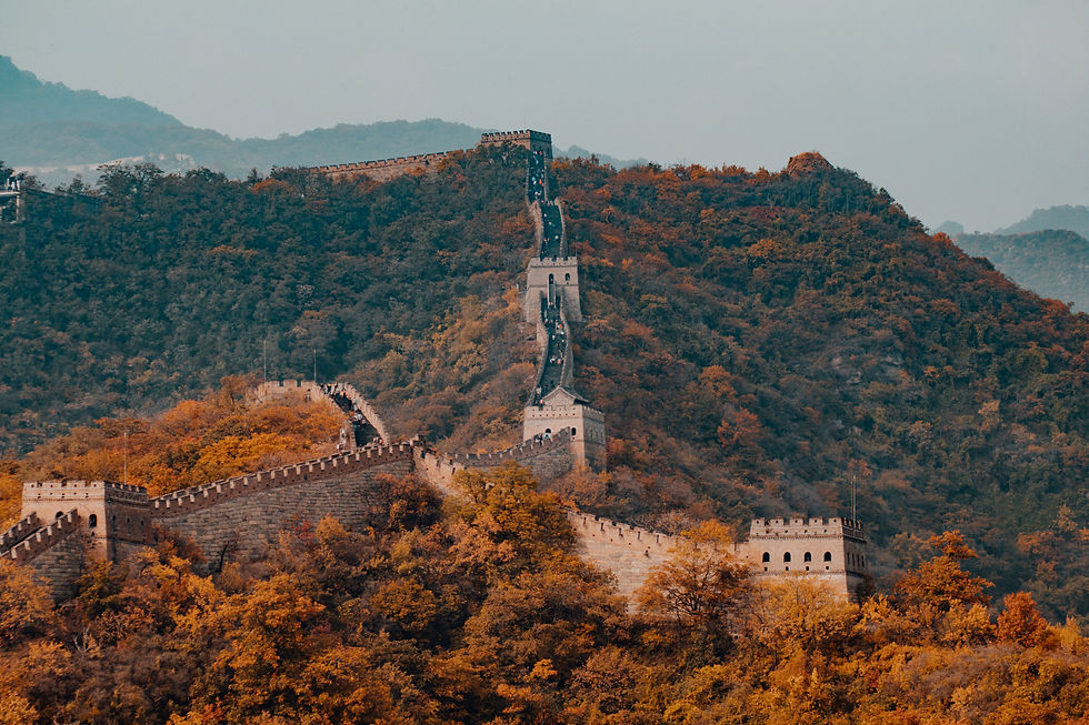 Great Wall of China along a forested mountain ridge
