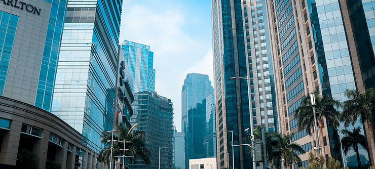 Indonesian city with tall buildings, highlighting top recruitment agencies in Indonesia
