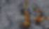 Robotic arms in manufacturing plant; orange and gray machinery. Production line with automation.
