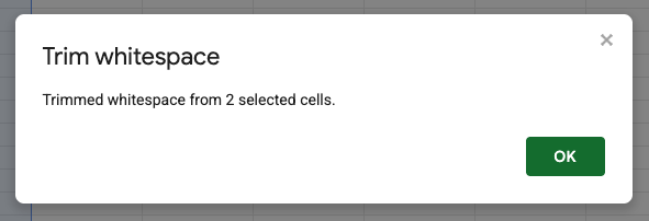 Popup message in spreadsheet app reads "Trim whitespace. Trimmed whitespace from 2 selected cells." OK button below.