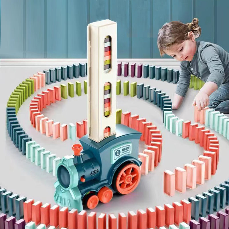 Automatic domino train set laying colourful dominoes