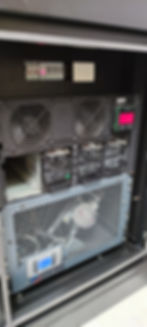 Eye-level view of a UPS system being overloaded with multiple devices