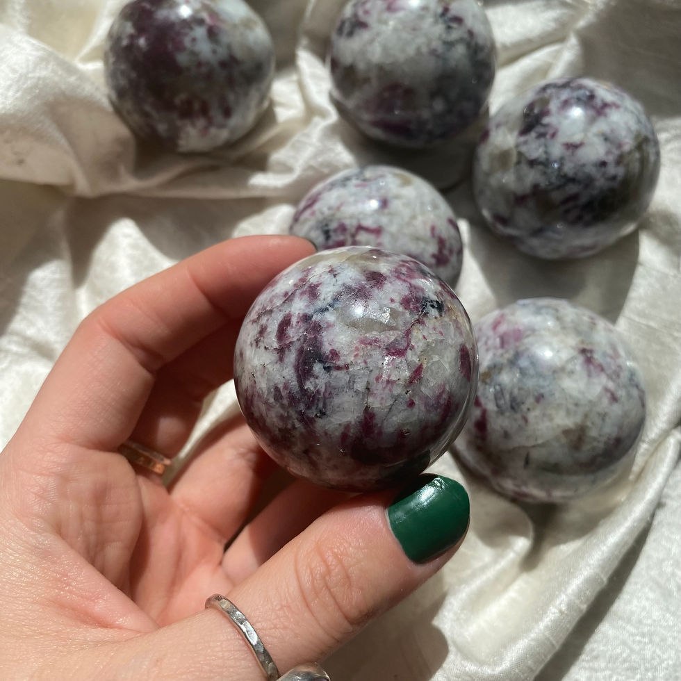 Rubelite (red tourmaline) in feldspar sphere