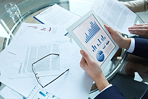 businessman-holding-tablet-with-statistical-data.jpg