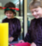 Two children making craft