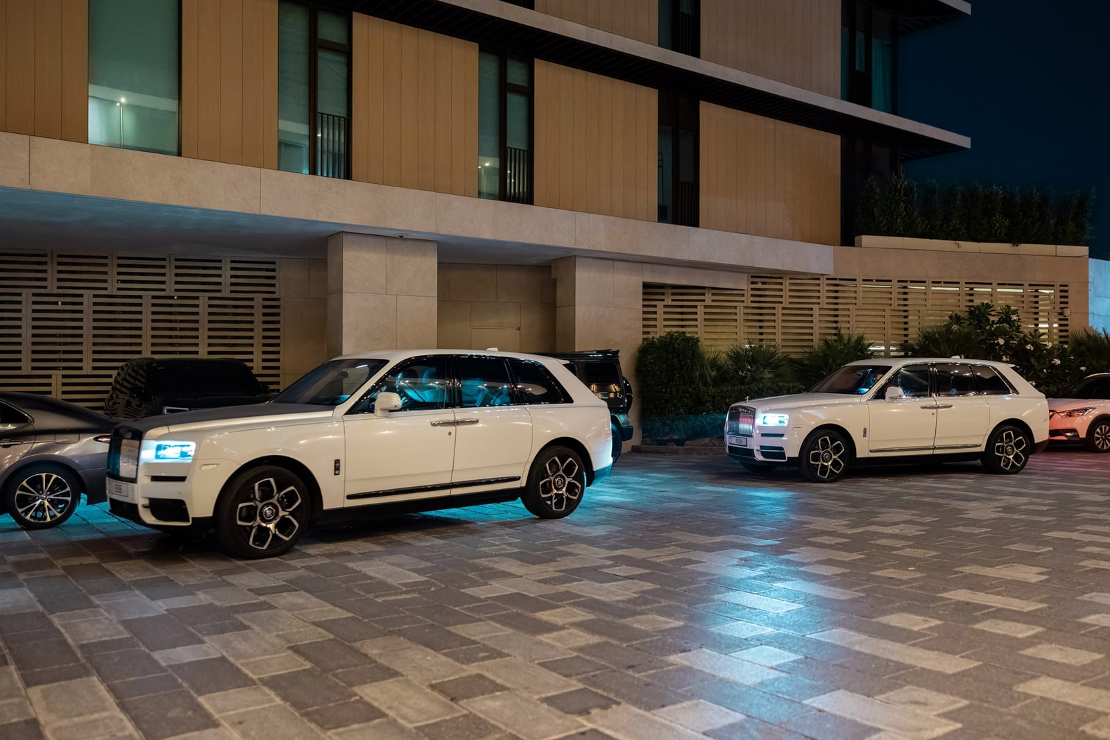 An evening fleet outside a private venue