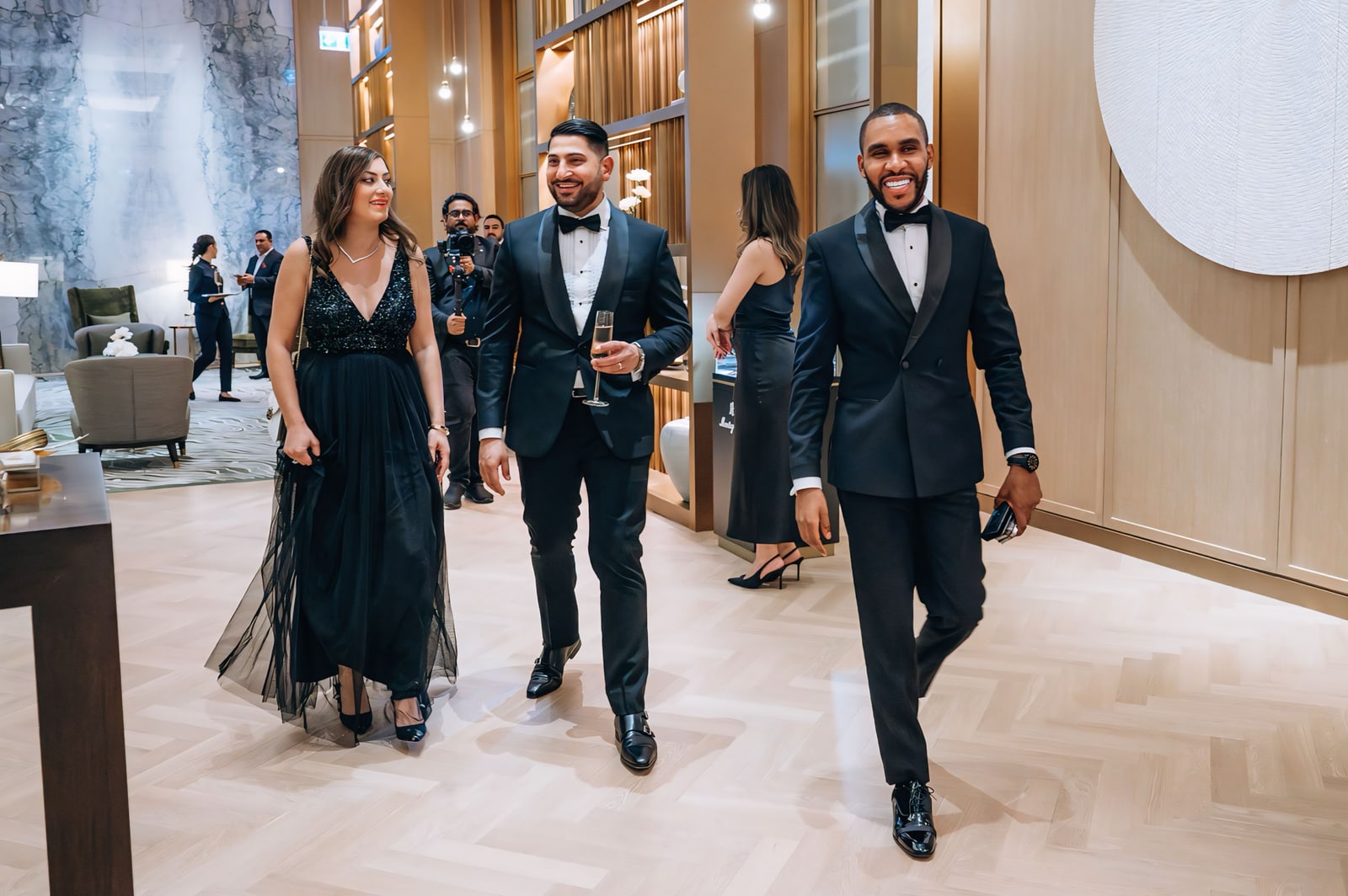 Mr K Nations walking with guests at an evening programme