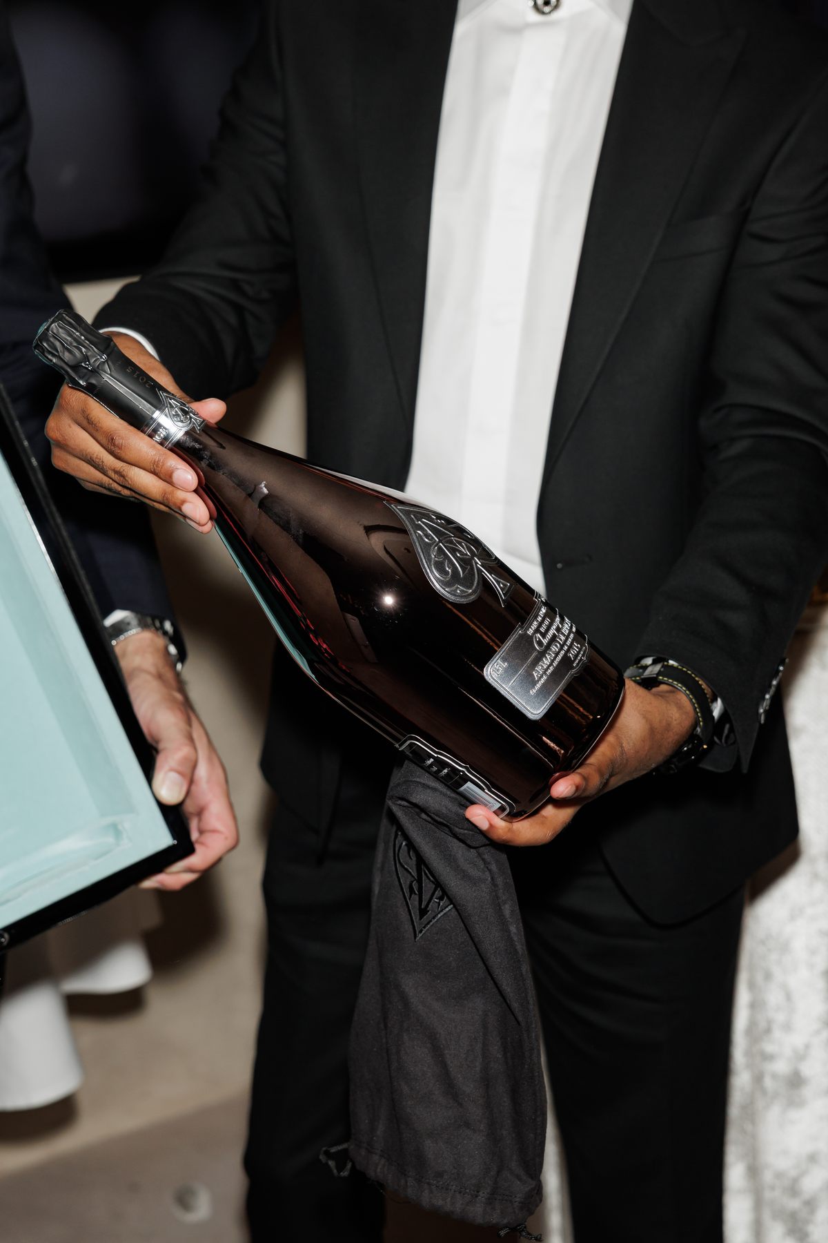 Mr K Nations receiving the Armand de Brignac and Tiffany & Co. collector bottle at NAHATÉ Dubai — selected frame 09