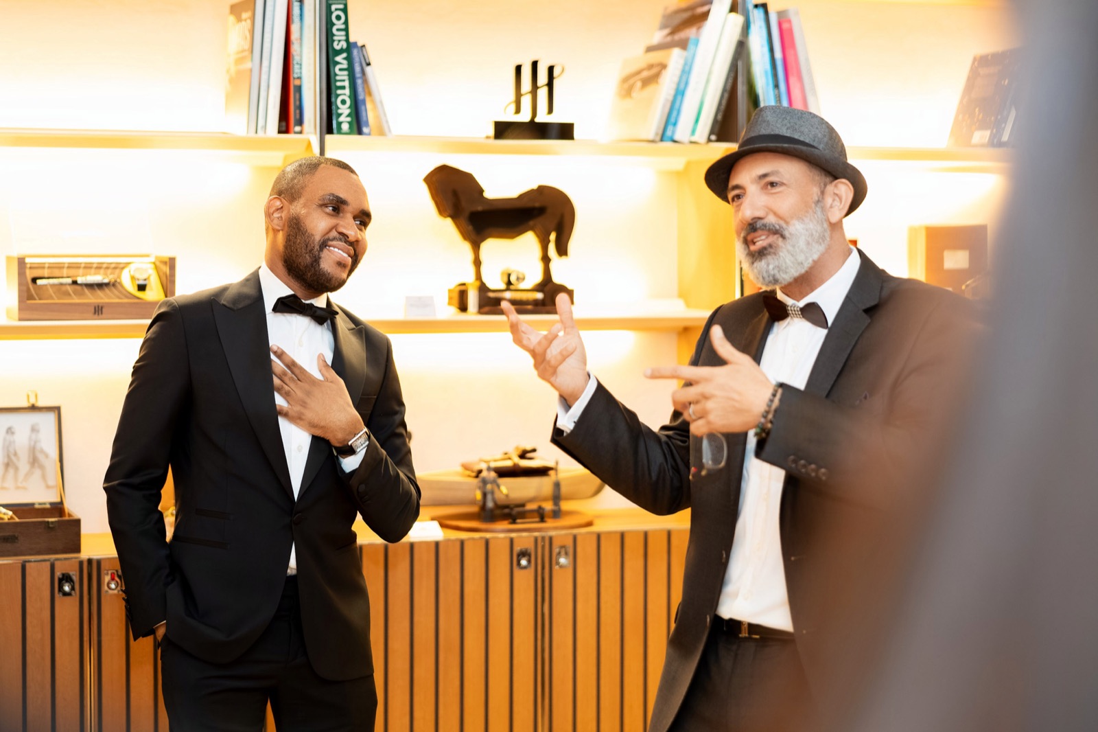 Two people in conversation at an intimate gathering
