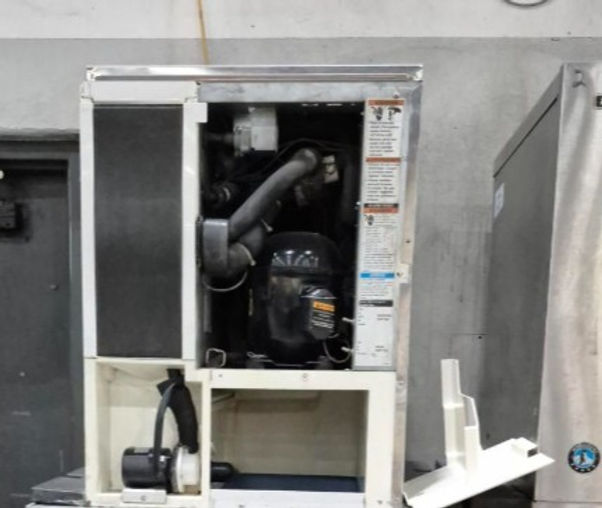 Close-up view of a commercial ice machine in a kitchen setting