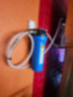 Eye-level view of technician inspecting water filtration system