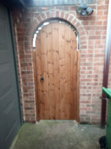 Arch topped ledged and braced single