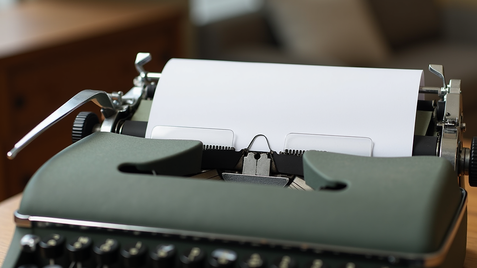 Close-up view of a vintage typewriter with a blank page