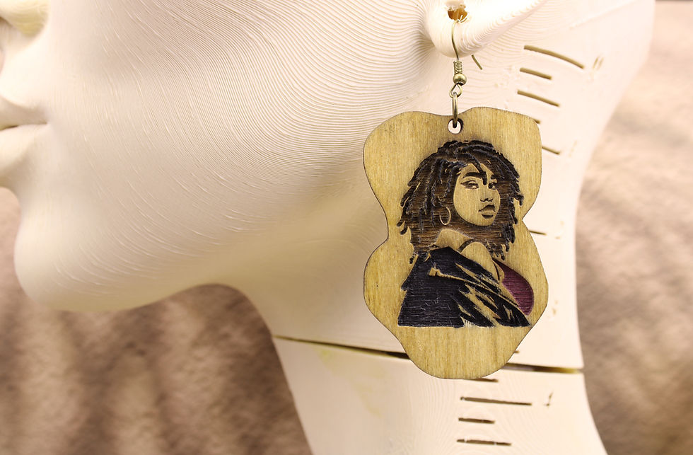 Wooden earring with a woman portrait for Loc’d Confidence.