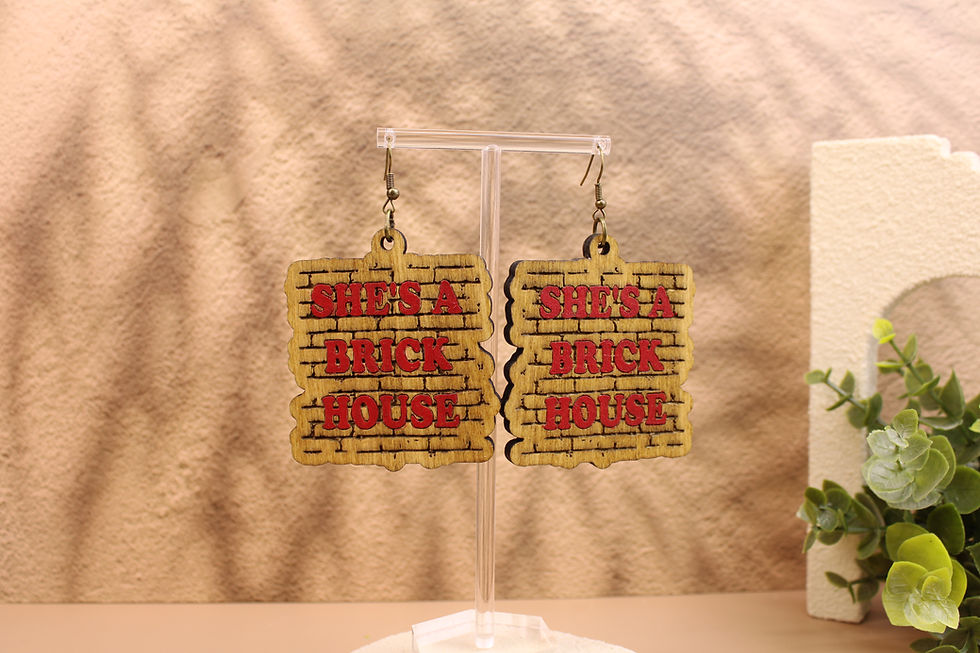 She's a Brick House wooden earrings on a stand.