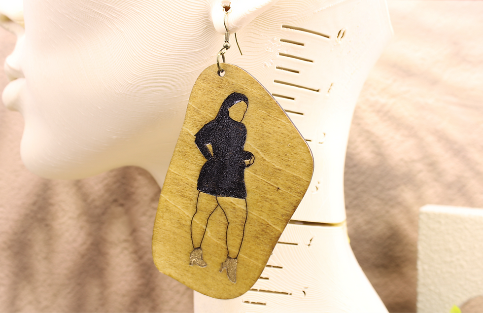 Boss Babe Silhouette earring on a mannequin ear.