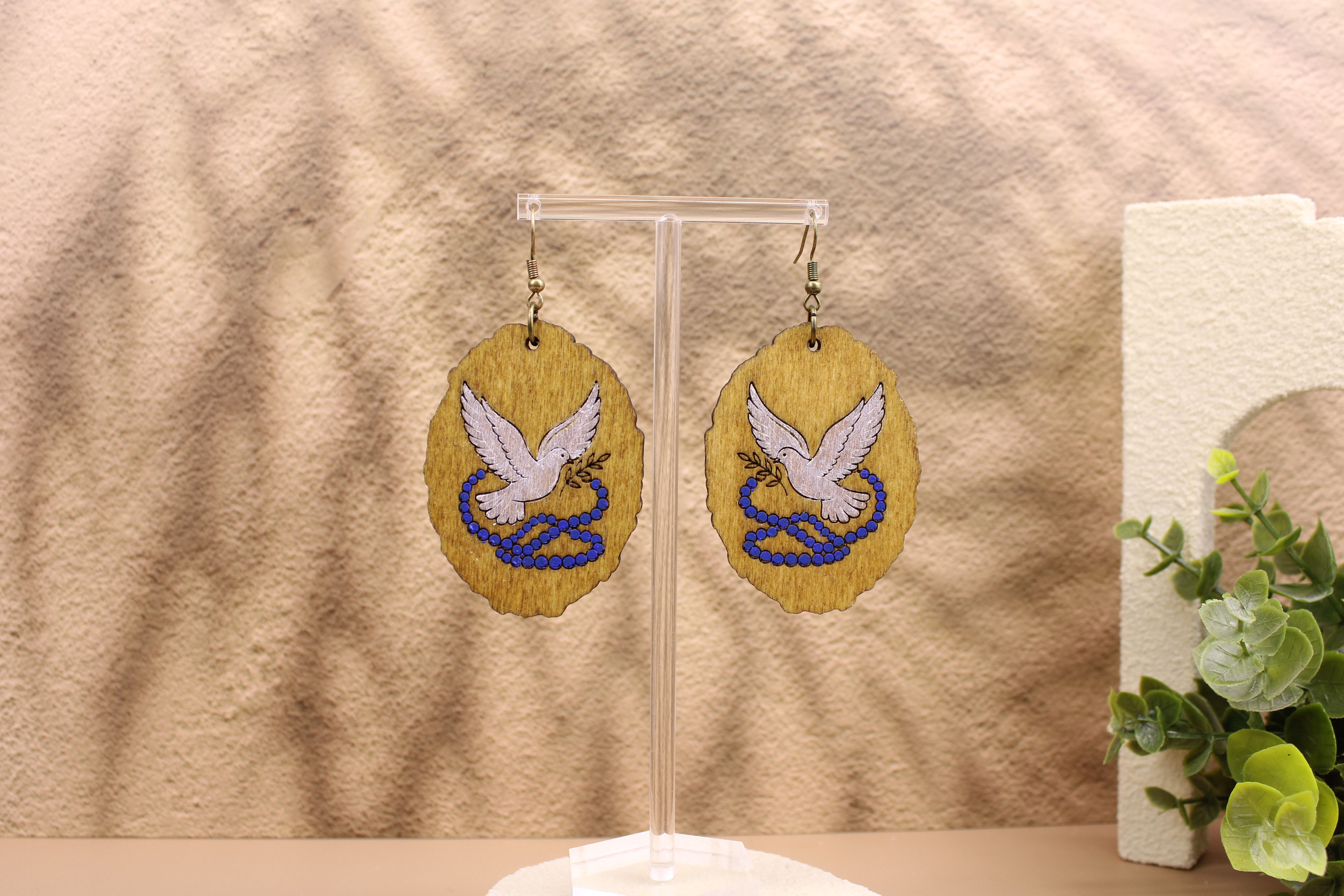 GTC520 earrings featuring a dove and snake design