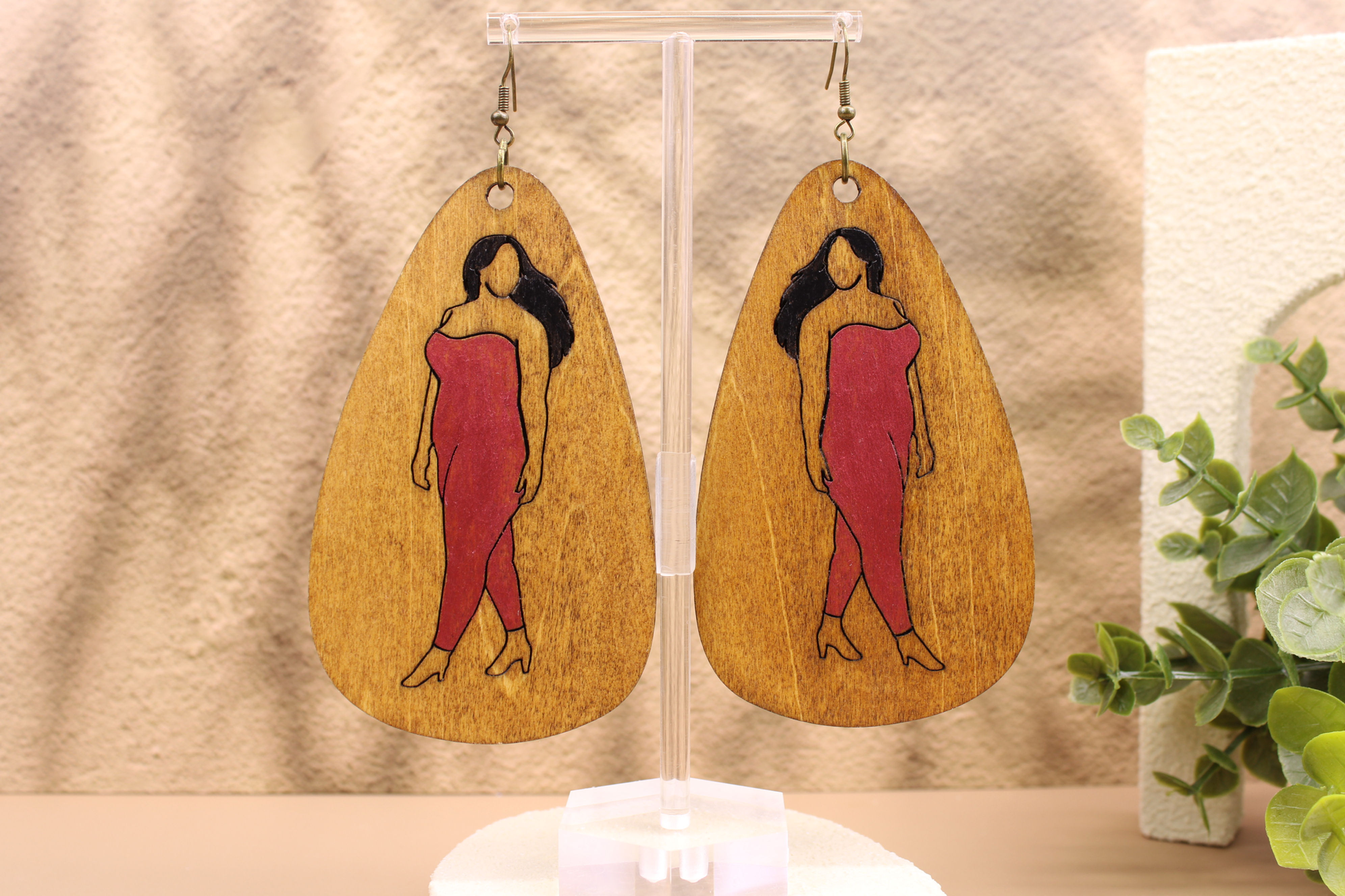 Wooden teardrop earrings with curvy woman in pink dress