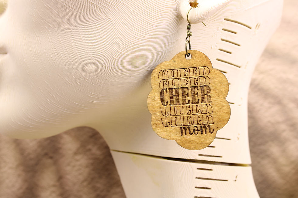 Wooden Cheer Mom earring on a mannequin